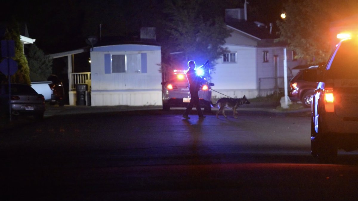 Police are looking for the male suspect who broke into a mobile home near 3400 South and 4240 West and allegedly threatened two people with a knife before fleeing into the night.