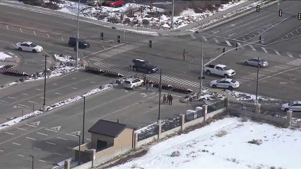 West Gate closed at Utah's Hill Air Force Base.   A white SUV appears to have been stopped by the raised wedge barriers