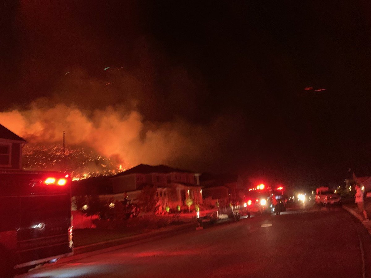 Flames are dangerously close to homes on the Lehi side of Traverse Mountain after tonight's strong winds caused a fire to flare up. At least 30 homes have been evacuated. 