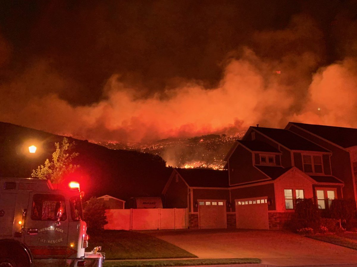 Flames are dangerously close to homes on the Lehi side of Traverse Mountain after tonight's strong winds caused a fire to flare up. At least 30 homes have been evacuated. 