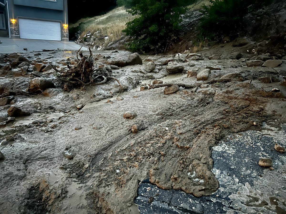 A water line break east of I-215 at 3100 S caused a mud slide after 8pm tonight. 3 homes evacuated, 1 with significant mud in the basement. No injuries reported. Water was shut off for cleanup, and crews assisted with diking the mud flow 