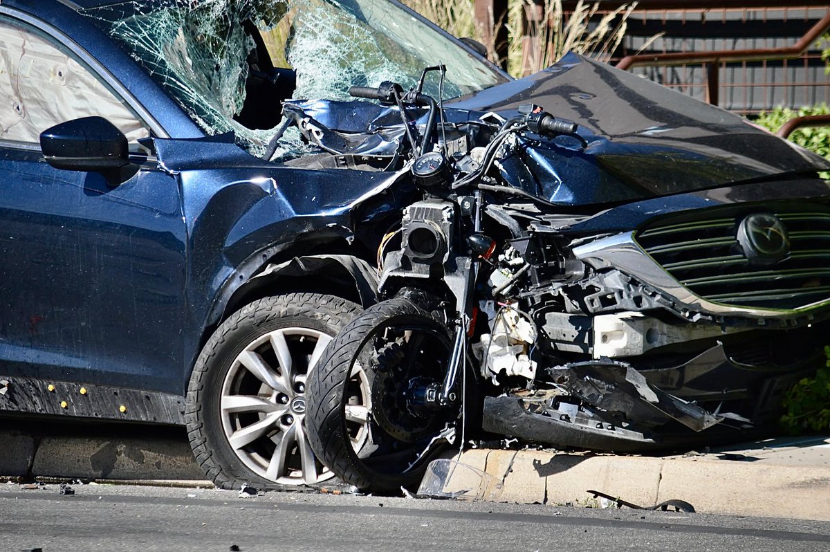 3300 S 200 E. Crash with Fatal Injuries. The Motorcycles front end including the handle bars, front wheel, and speedometer are impaled to the side of the vehicle. Driver of vehicle transported with non life threatening injuries 